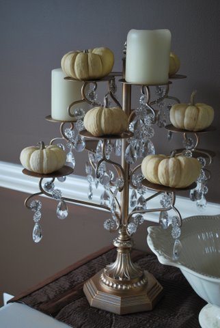 Candleabra with pumpkins and candles