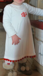 White Christmas dress with red pompom fringe