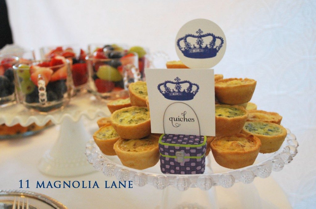 Quiche, and fruit served in the glass teacups that match the plates