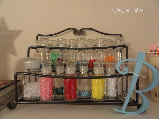 spice rack (with spice bottles) to organize beads and small craft items