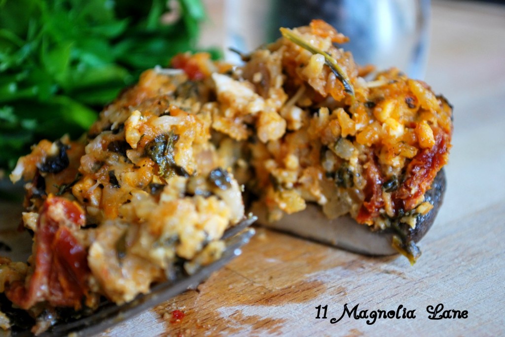Stuffed Portabella Mushroom overflowing with Spinach, Sundried Tomato, Feta and rice filling.
