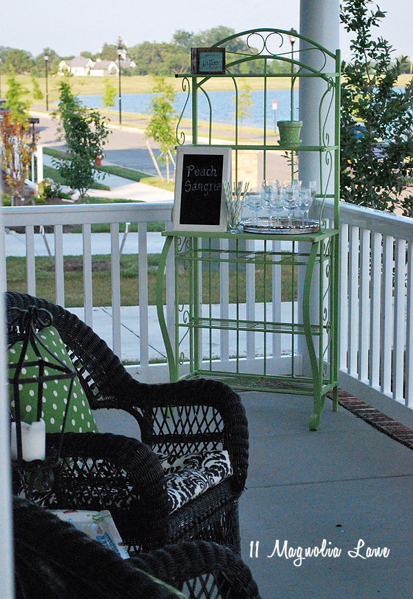 Baker's rack spray painted a bright color and used as a drink bar on the porch