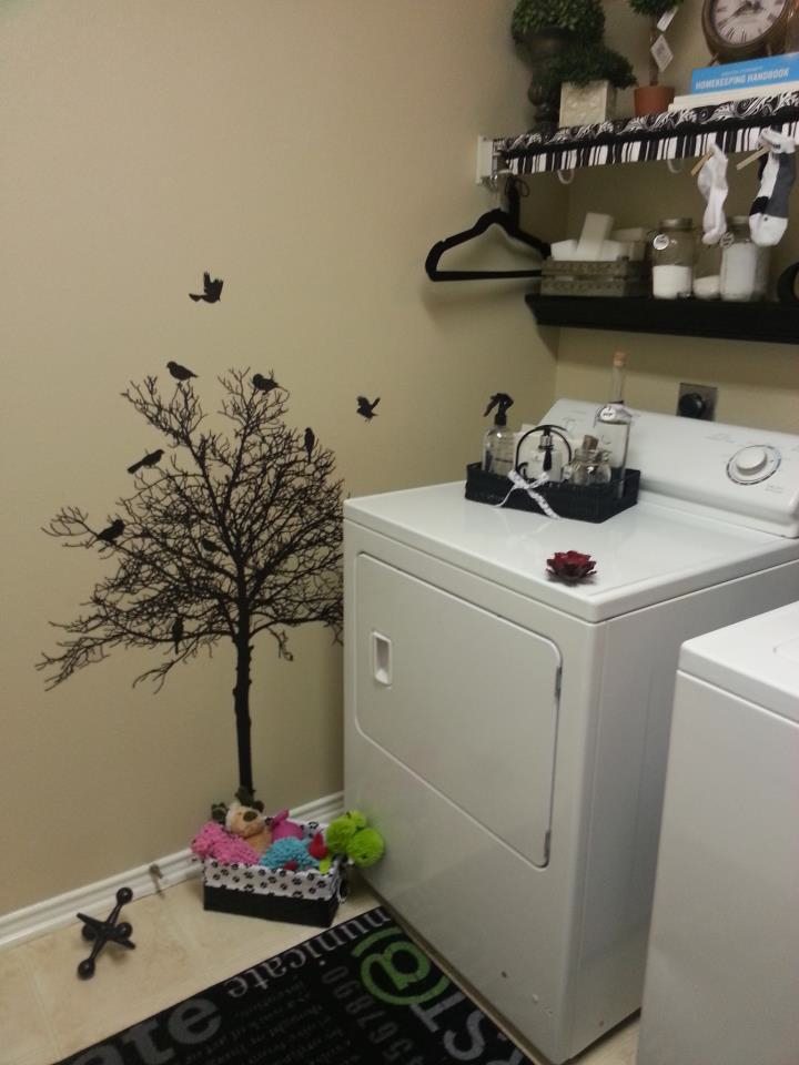 Black vinyl tree in laundry room