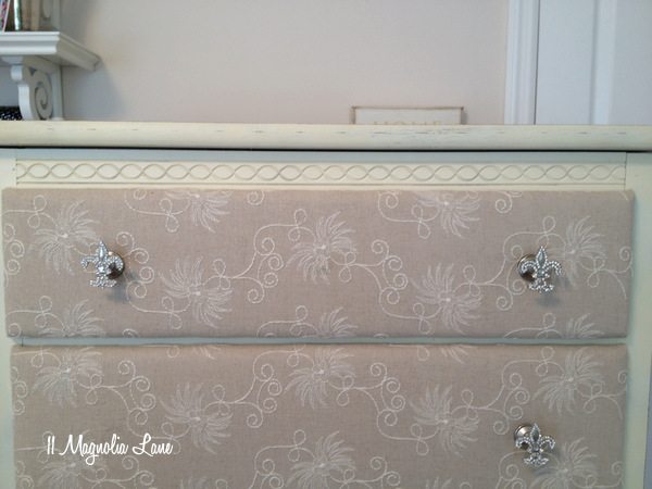 Close up of fabric-covered drawers