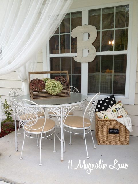 chippy white iron table and burlap seat cushions