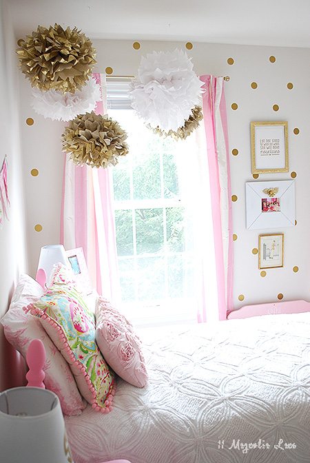 A cute girl's room decorated with gold and pink