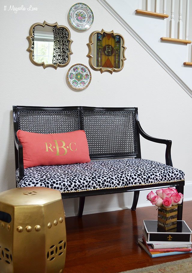 Black cane bench with dalmation print seat and gold nail head trim | 11 Magnolia Lane