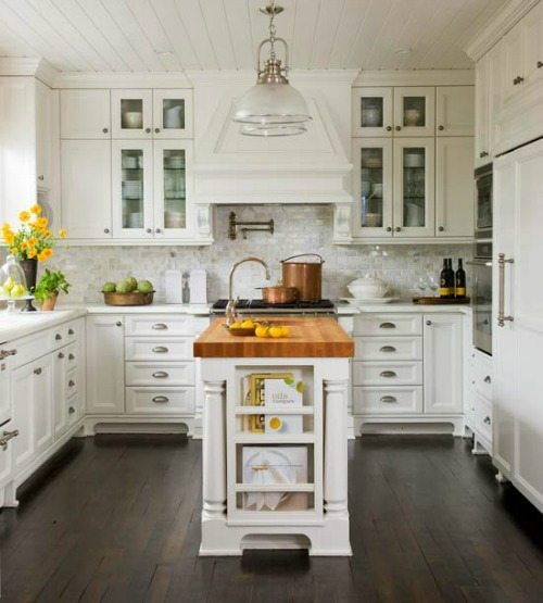 Butcher block island with white cabinets 