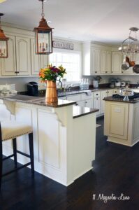 French country kitchen with off-white cabinets and copper accents | 11 Magnolia Lane