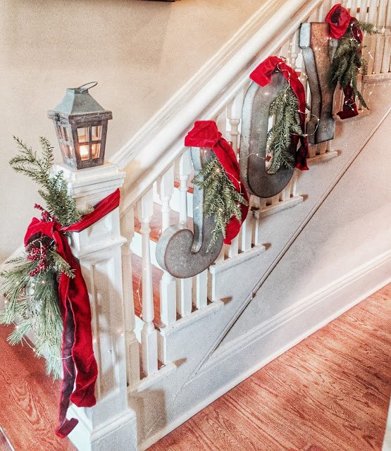JOY Christmas banner on staircase from galvanized metal letters | Quarters One