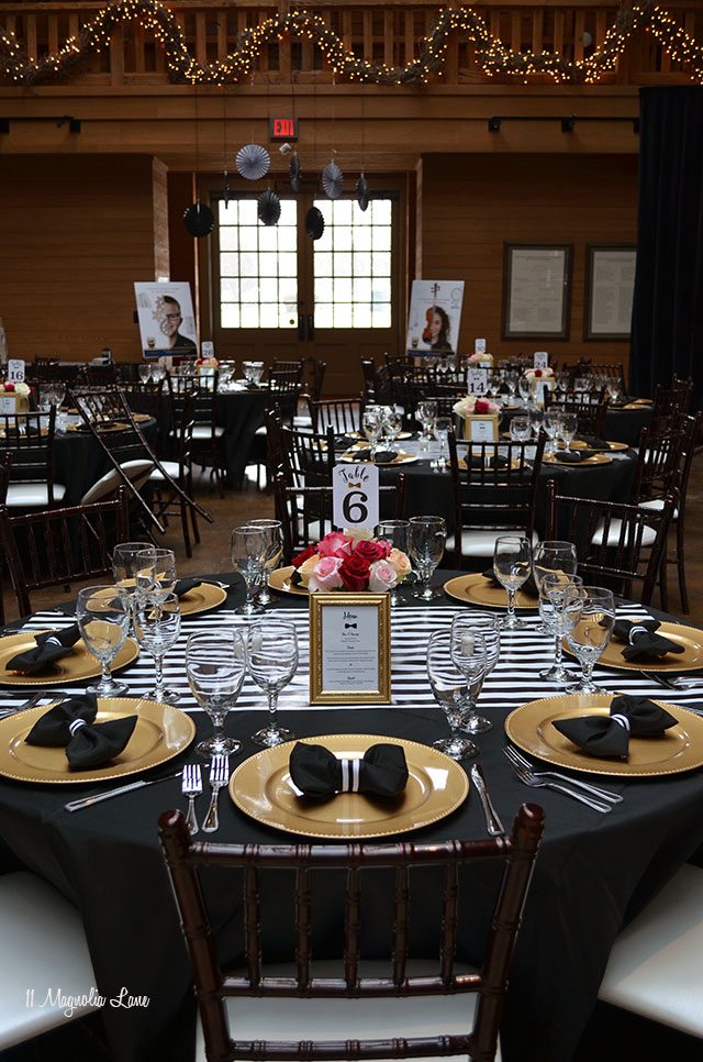Formal event decor: black and white stripes with gold
