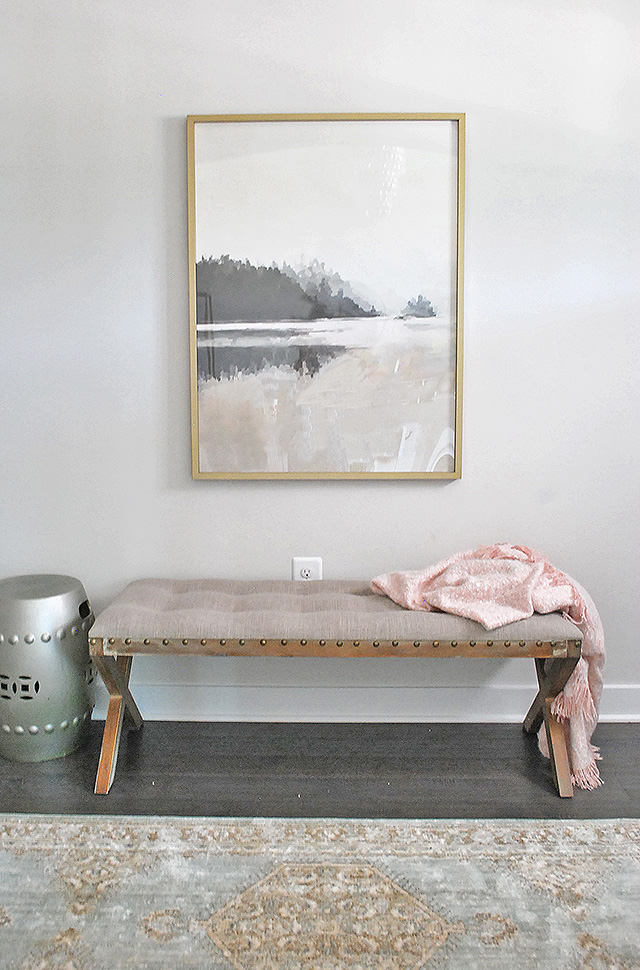 Beautiful artwork from Minted paired with a rustic bench makes for a welcoming entryway.