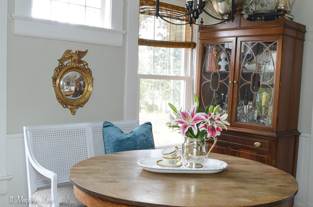 Vintage French cane bench used as dining banquette | 11 Magnolia Lane