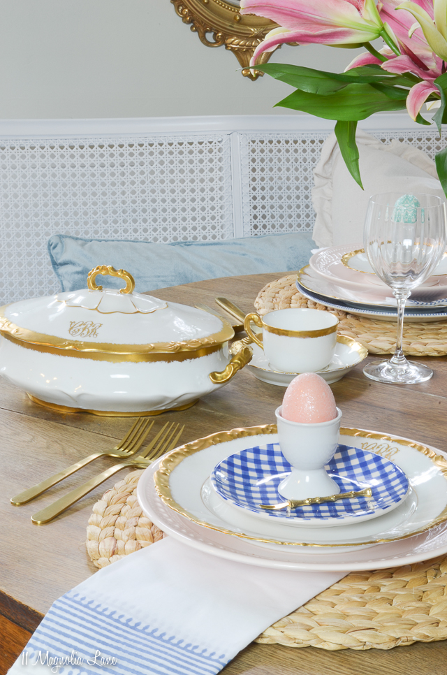 Easter spring table setting with blue willow china, gold and white monogrammed vintage Limoges porcelain, blue gingham appetizer plates, and gold flatware | 11 Magnolia Lane