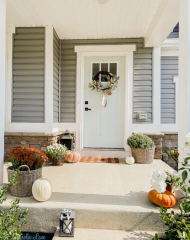 craftsman style front porch decorated for fall